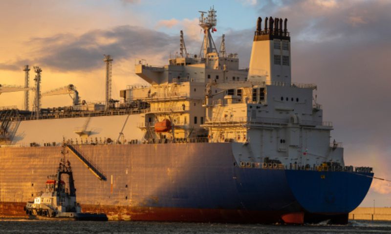 Giant merchant navy ship sailing during sunset
